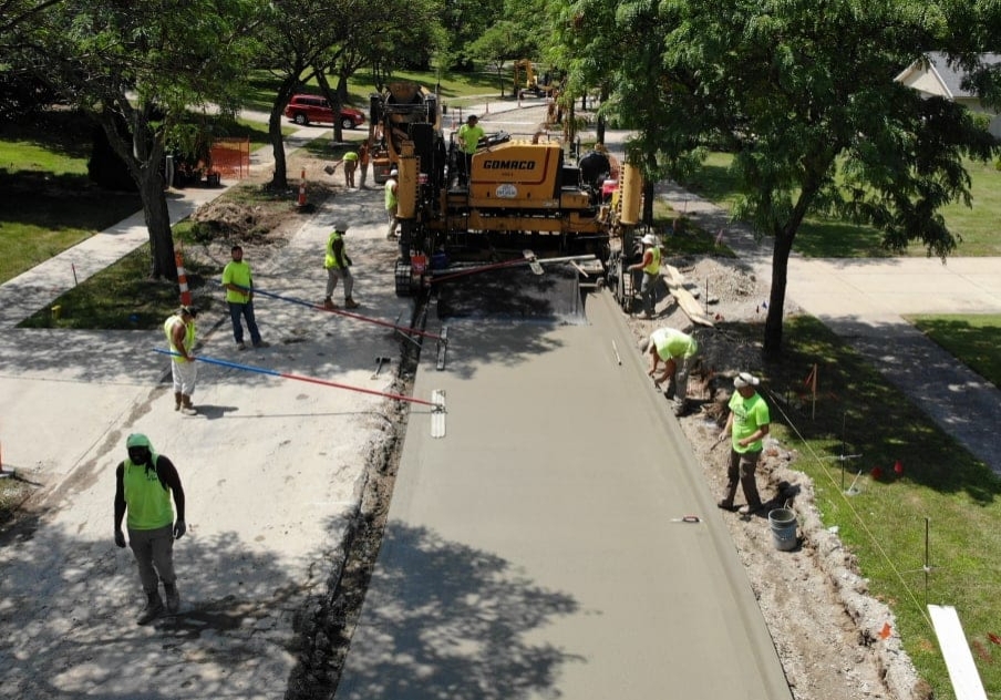 careers-fast-paced Concrete roadway installation using a slip form concrete truck